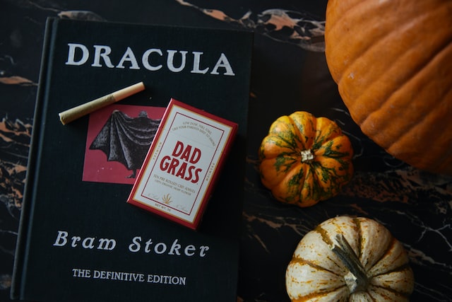  Free Audio Books: Dracula book with cigarettes and pumpkins